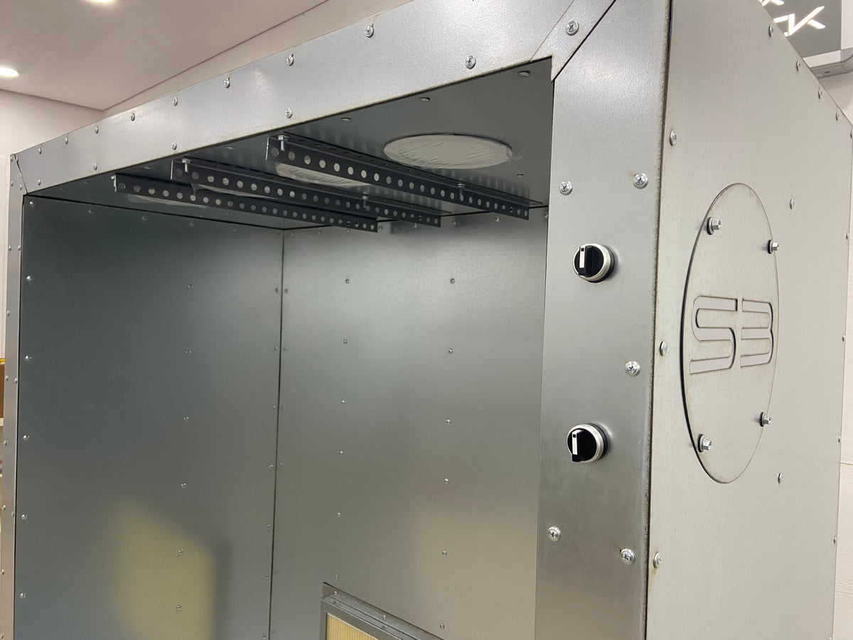 The 6x4x2 booth's light and fan switches and Silverback badge