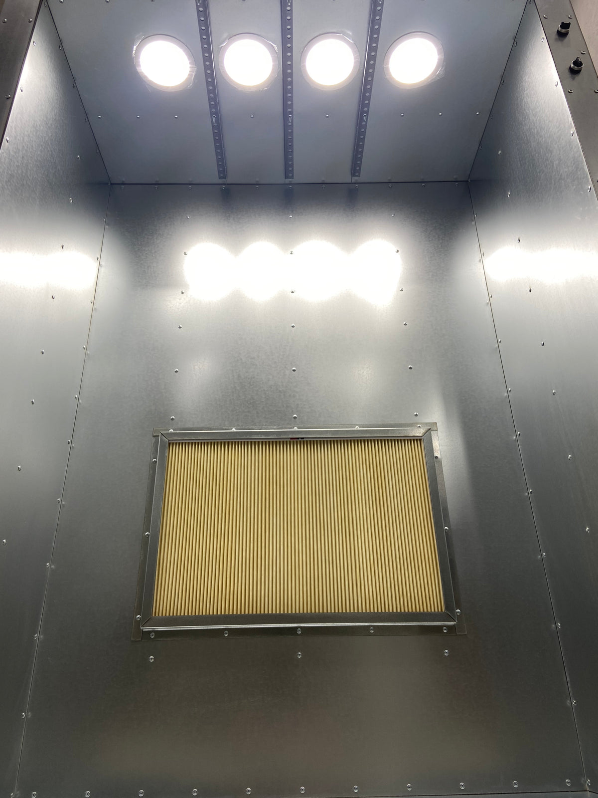 Inside the 6x4x2 spray booth: filter frame and recessed ceiling lights