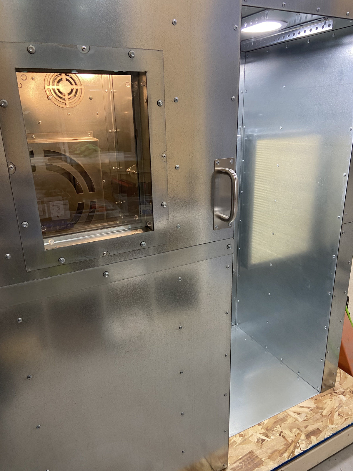 View window on the 5x2x2 combo door with the lit interior showing