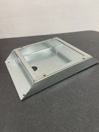 The included mounting bracket, holding the box off the hot surface