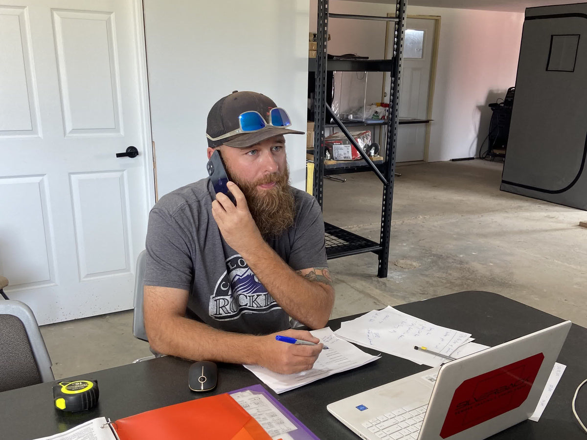 Mack on a call, notes out
