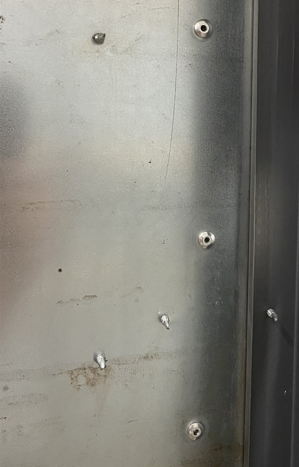 Permanent rivets down the frame seam, on top of standard fasteners
