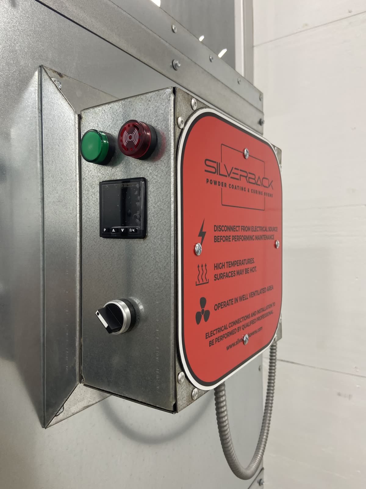 Control box on the stay cool standoff bracket showing the 2 inch air gap between the box and the oven wall