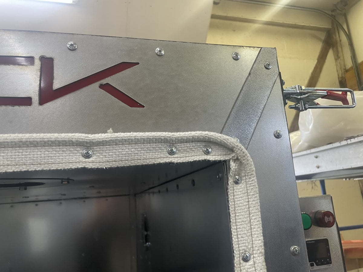 45 degree mitered face trim covering the seam at the top corner of a Silverback oven door opening