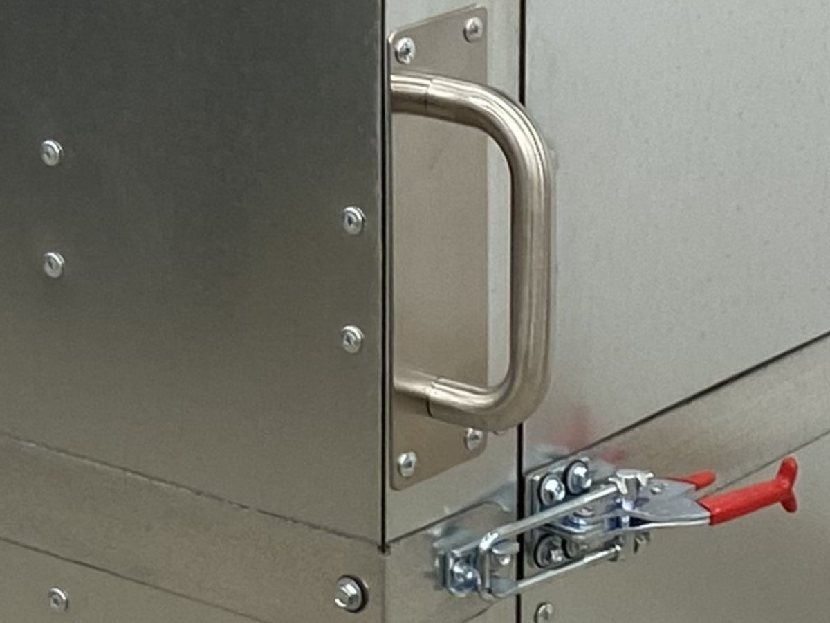 Silverback oven door handle mounted on the side face of the door