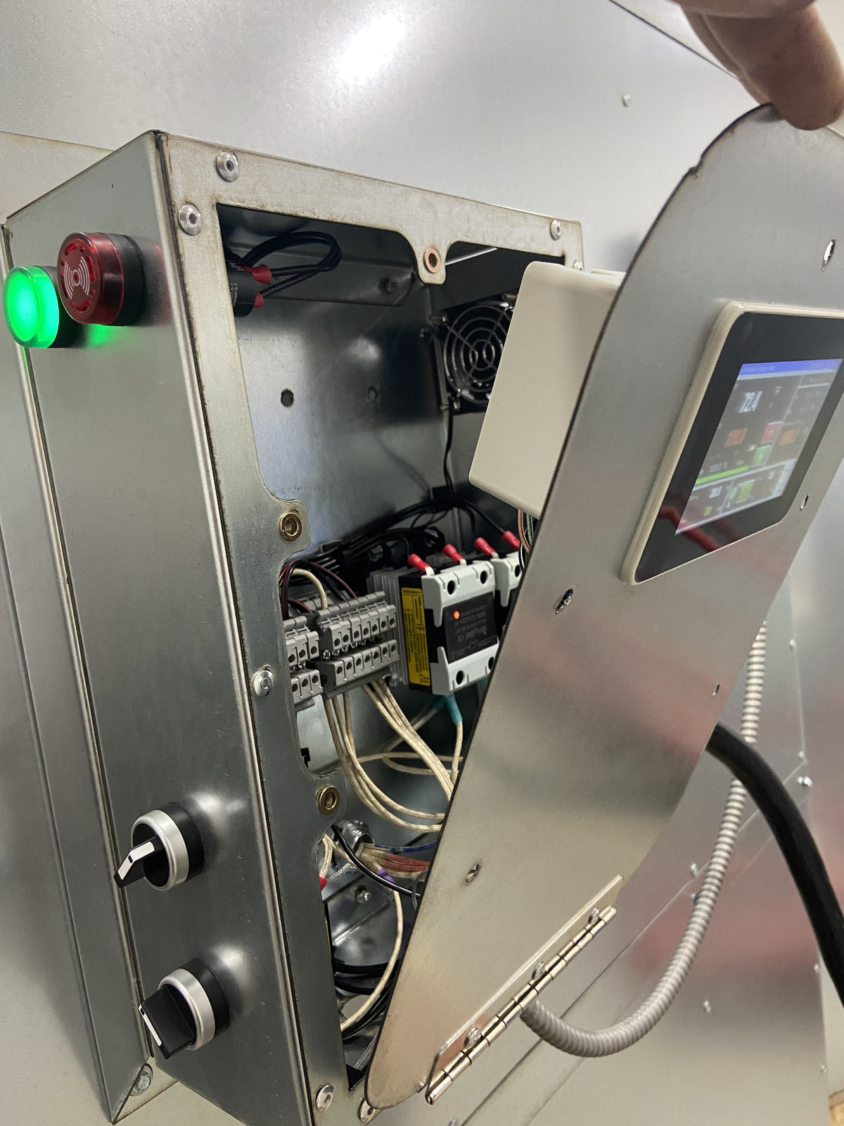 Touchscreen PID controller with the hinged cover open, wiring channel visible